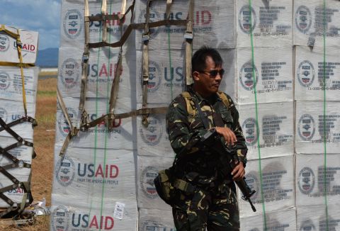 A Philippine soldier guards U.S. aid at the Tacloban airport on November 15. 