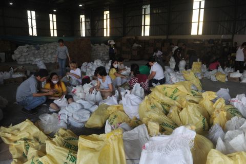 Volunteers in Manila, Philippines, prepare relief goods for typhoon survivors on Thursday, November 14.