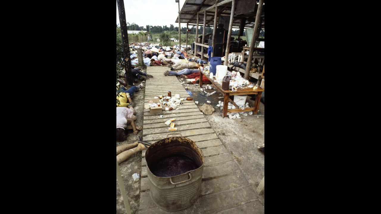 Bodies lie in a room near a tub of cyanide-laced punch.