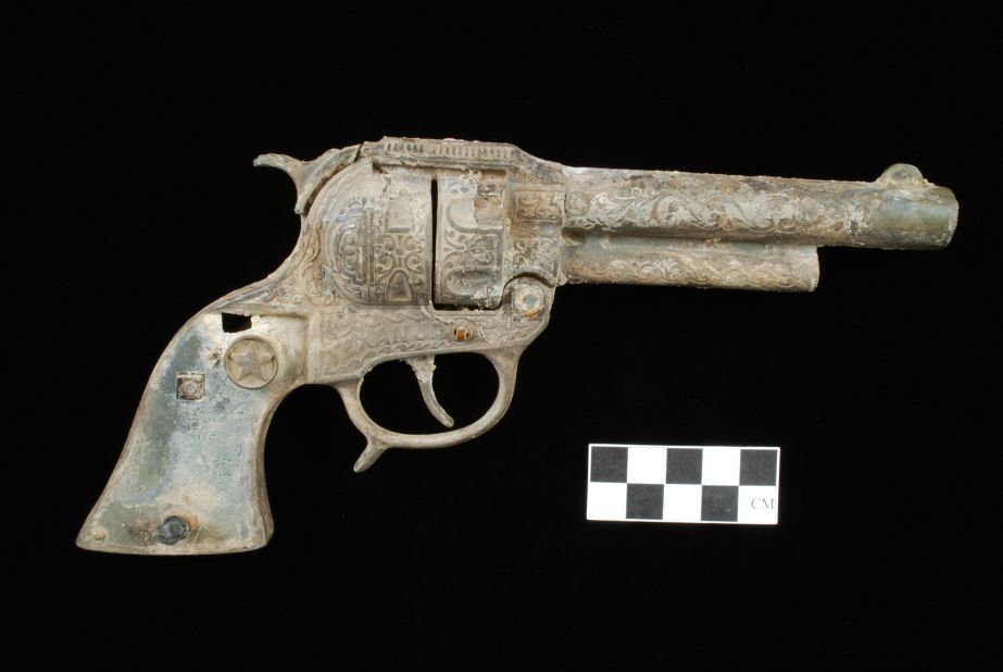 A mid-20th century Hubley Long Barrel Texan Jr. cap gun. This artifact represents a transition in toy gun manufacturing from pure cast-iron to die-cast cap guns. The Hubley Manufacturing Co. was founded in Lancaster, Pennsylvania, in 1894, and produced cast-iron toys, doorstops, bookends and other objects. All Hubley toys were hand-painted and are now collectors' items.