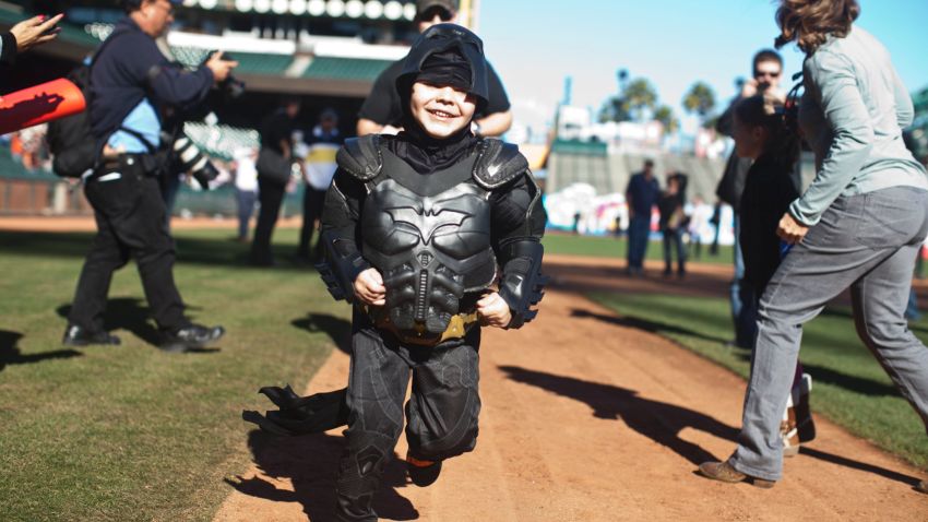 Leukemia survivor Miles, 5, dressed as BatKid, runs the bases as part of a Make-A-Wish foundation fulfillment at AT&T Park November 15, 2013 in San Francisco. The Make-A-Wish Greater Bay Area foundation turned the city into Gotham City for Miles by creating a day-long event bringing his wish to be BatKid to life.