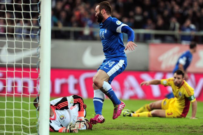 Dimitris Salpingidis scored one of the goals for Greece, which takes a commanding 3-1 lead to Romania in the fourth European playoff tie. 