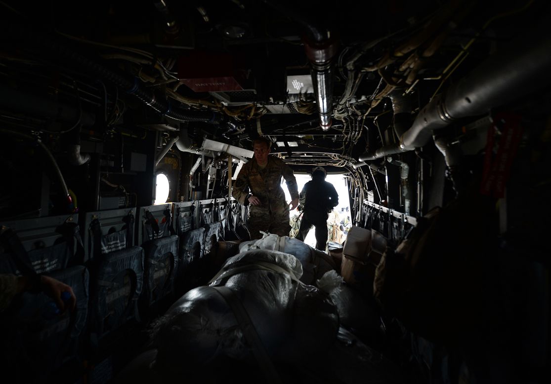 A U.S. Army Ranger unloads aid from an Osprey aircraft November 16 in Balangiga, Philippines.