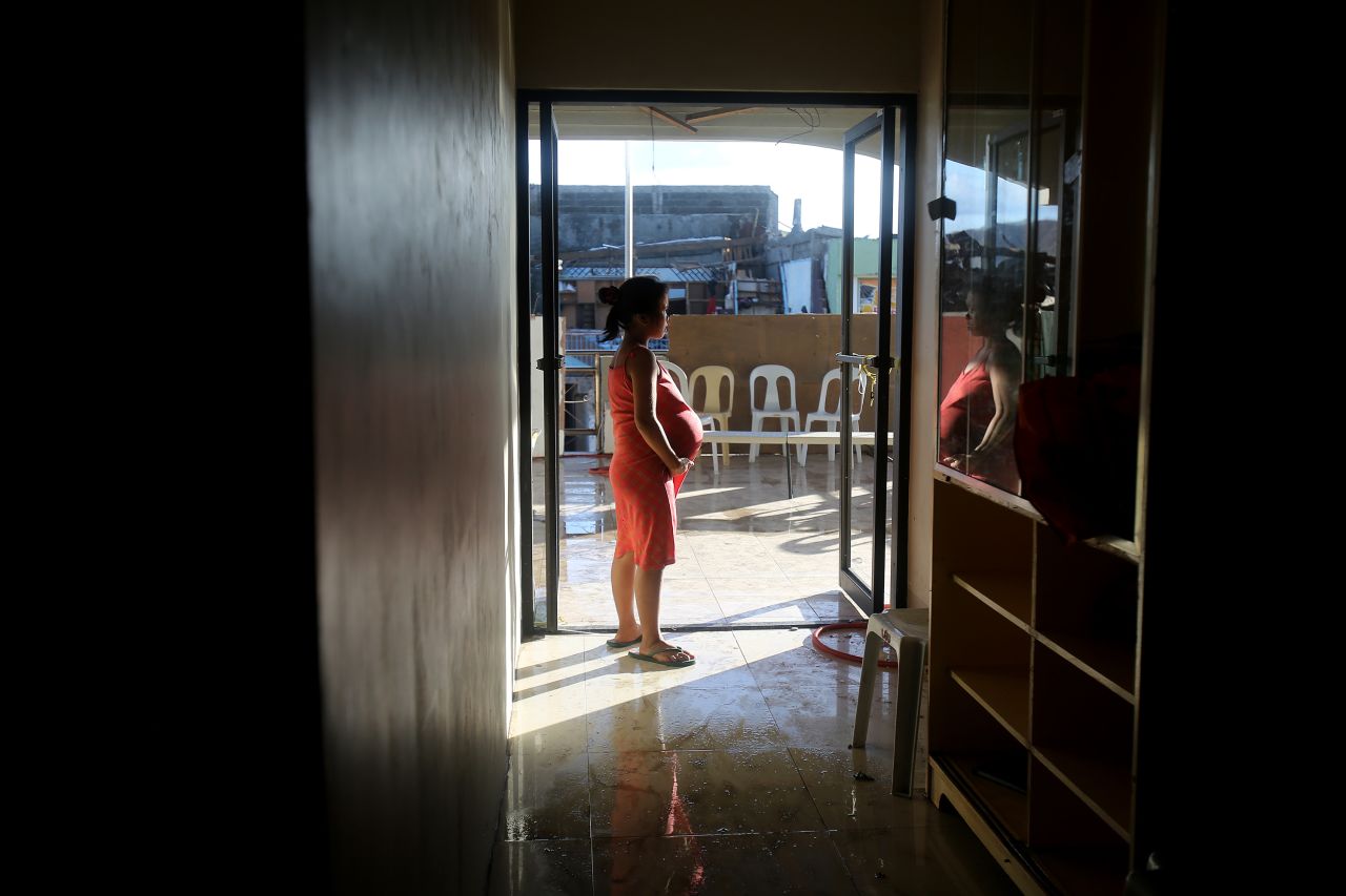 A pregnant survivor waits to give birth in a hospital November 16 in Tanauan.