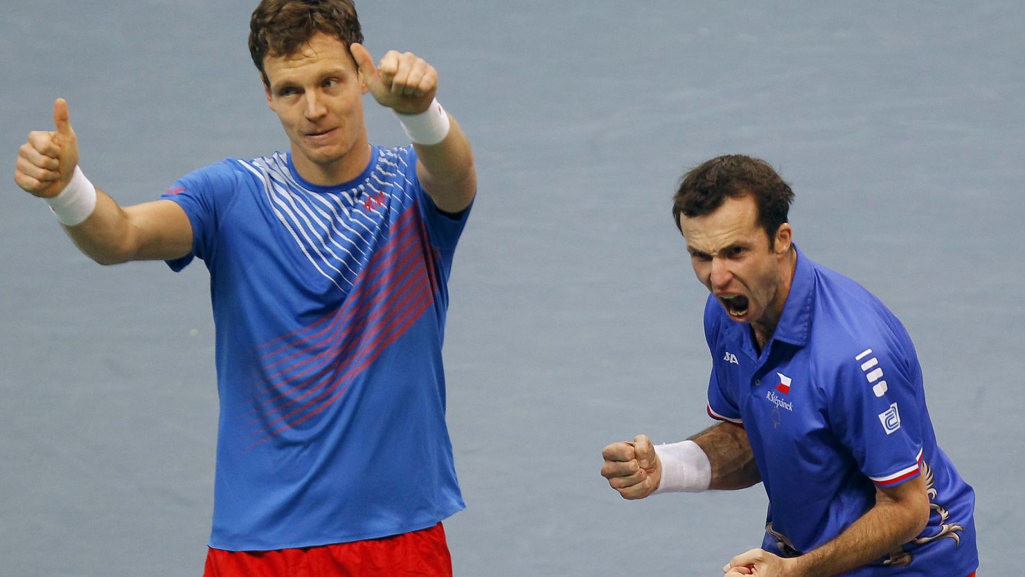 Tomas Berdych and Radek Stepanek celebrate their crucial victory in the doubles in the Davis Cup final to give the Czech Republic a 2-1 lead.  