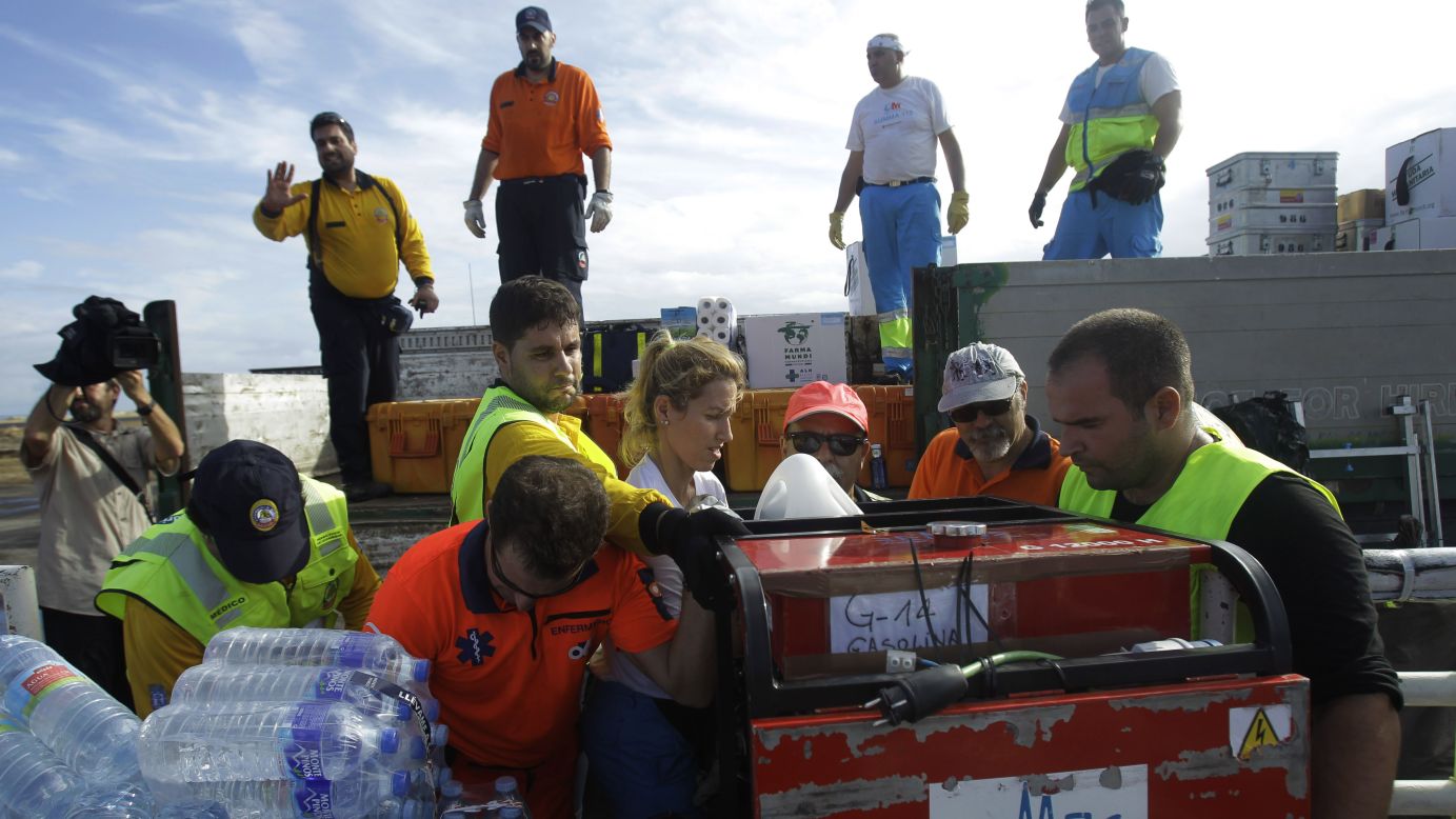 An emergency team from Spain unloads relief supplies November 17 in Tacloban.