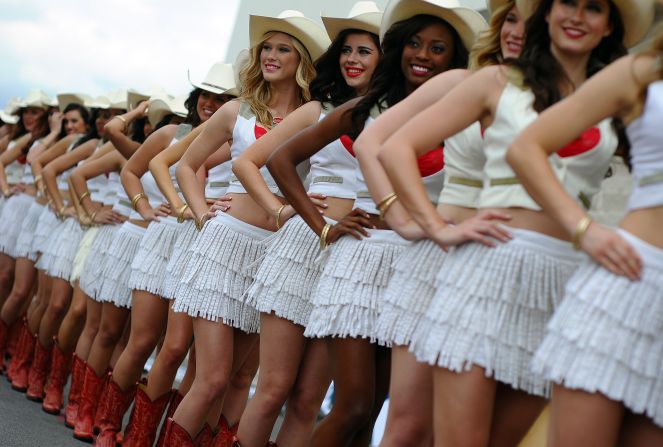 Guard of honor. The Texas grid girls line up with strict precision as they add their own touch of style and glamor to proceedings in Austin.