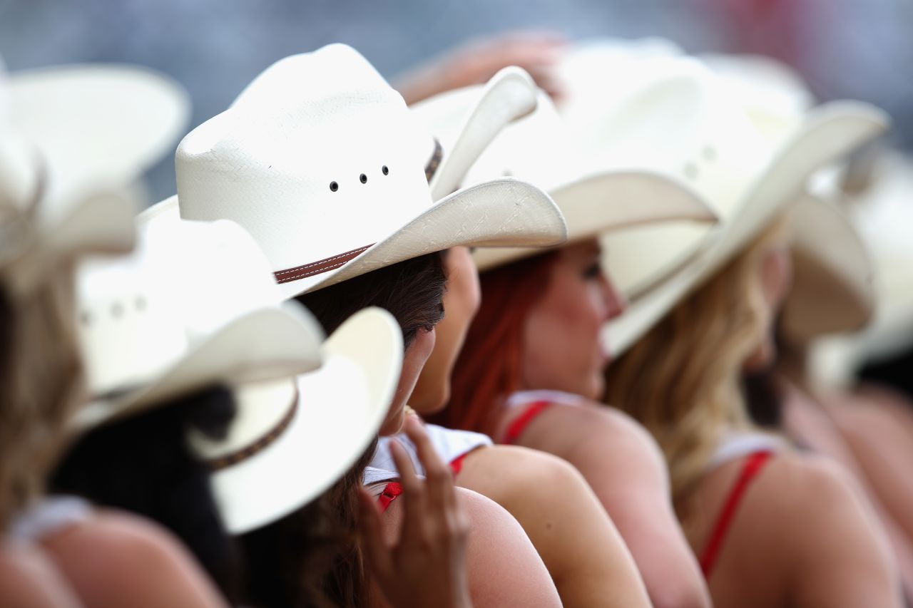 Cowboy style hats are very appropriate headwear for the grid girls to wear in the paddock at the United States Grand Prix in Texas.