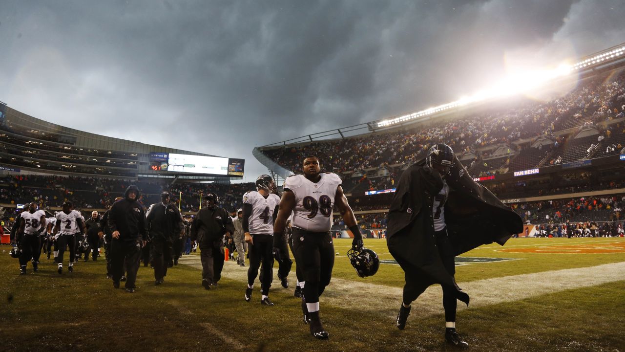 Baltimore Ravens players leave the field after the game was delayed on November 17.
