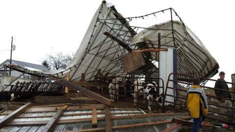A damaged cattle shed sits on a family farm in Hustisford, Wisconsin, on November 17. Dodge County Emergency Management Director Joseph Meagher says no cattle were injured.
