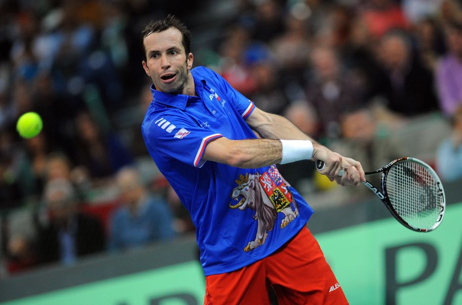 Radel Stepanek is the study of concentration as he hits a double handed back hand on his way to victory in the deciding singles rubber against Lajovic. 