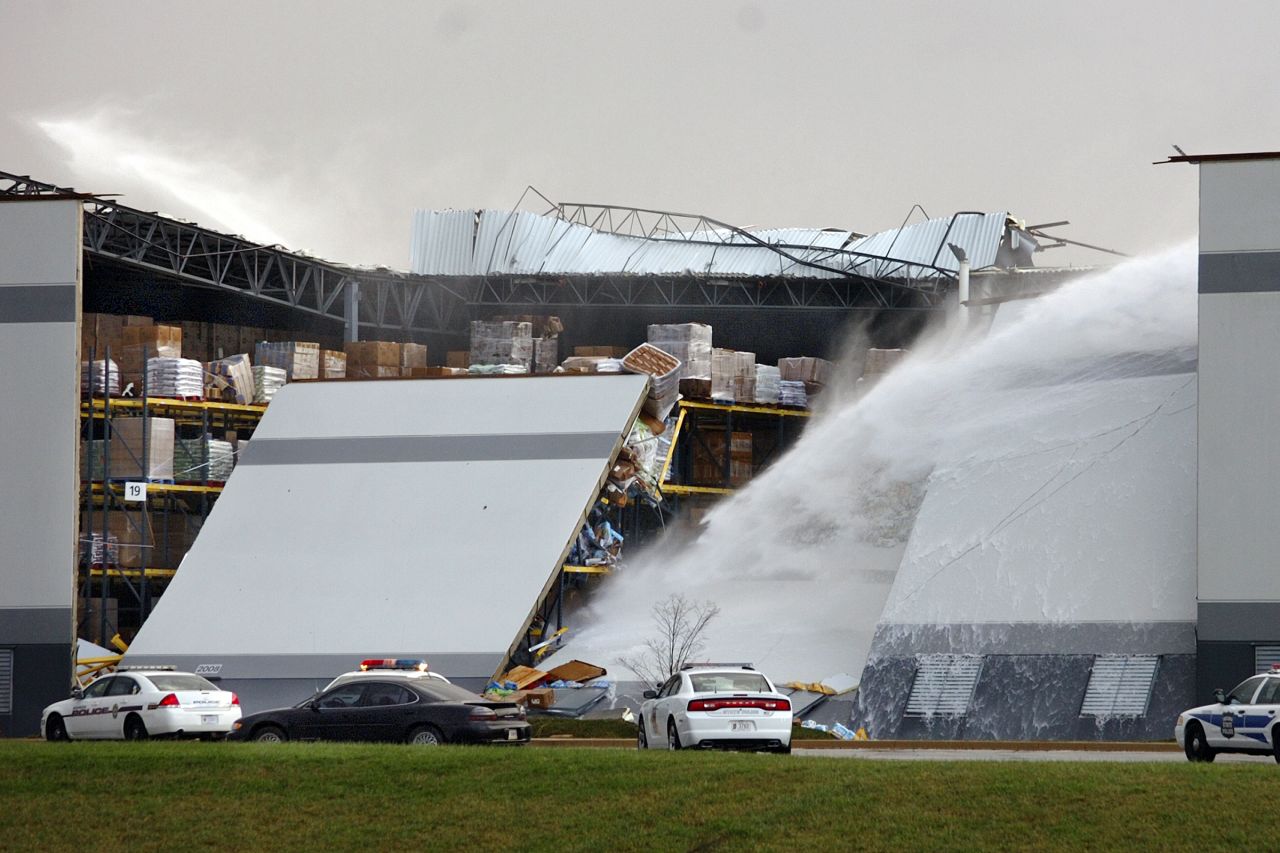 Water shoots from broken pipes after part of a wall and roof collapsed on November 17 at the Dollar General distribution center east of Marion, Indiana.