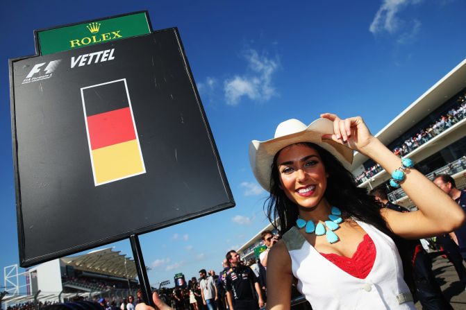 A Circuit of America's grid girl holds the board assigned to four-time champion and eventual race winner Sebastian Vettel.
