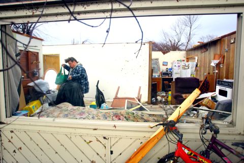Dave Huffman sorts through his belongings in the living room of his destroyed home in Kokomo, Indiana, on November 17. Kokomo is almost 60 miles north of Indianapolis, the state capital.