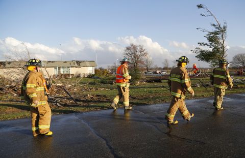 Firefighters survey the damage at Mintonye Elementary School in Lafayette, Indiana, on November 17. A series of strong thunderstorms pounded Tippecanoe County, northwest of Indianapolis, on Sunday.