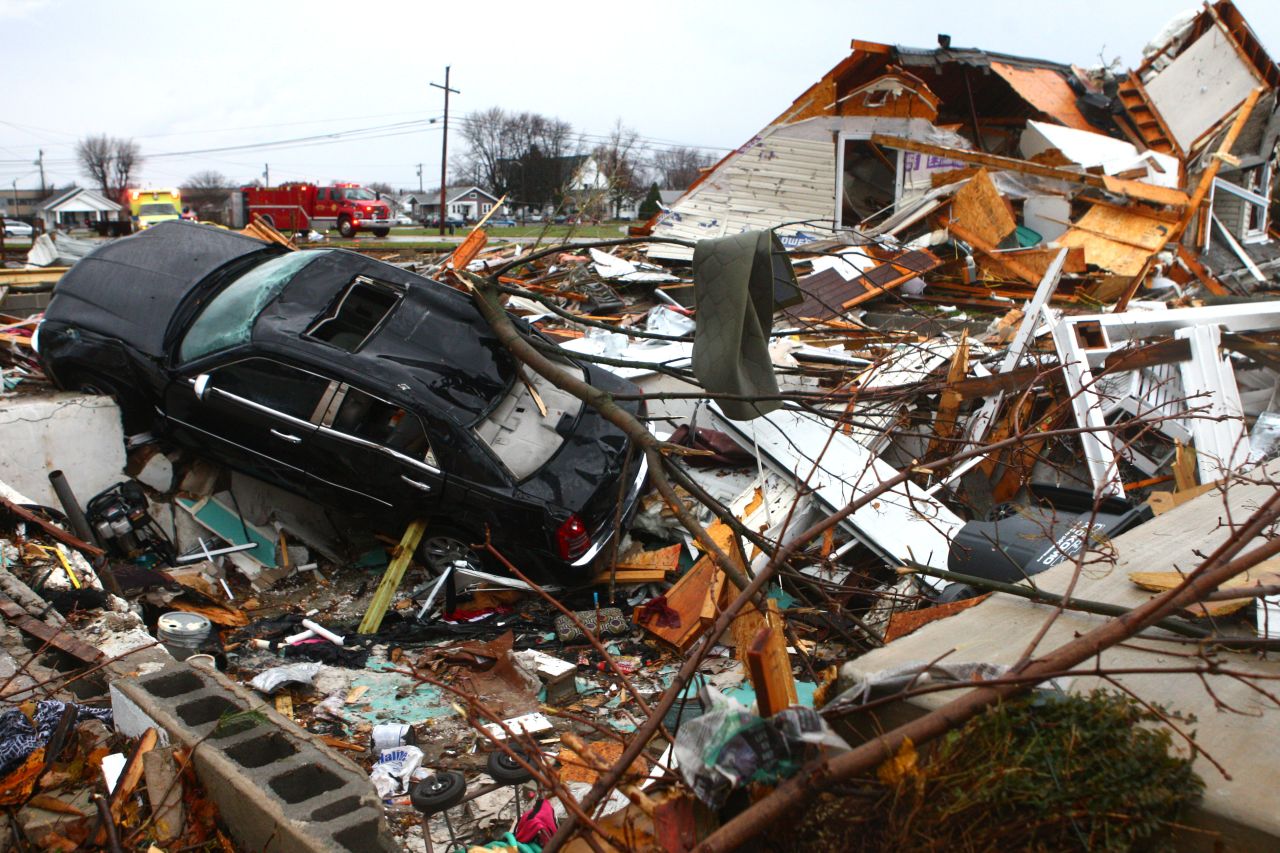 A car sits among the debris of a leveled home in Kokomo, Indiana, on November 17.