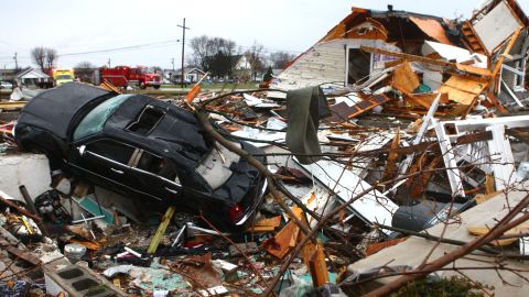 A car sits among the debris of a leveled home in Kokomo, Indiana, on November 17.