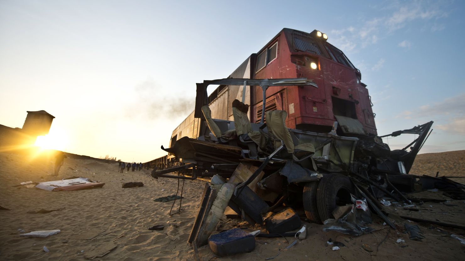 The wreckage of a minibus lies at the site of an accident near a railway crossing in Dahshur, Egypt, on Monday.