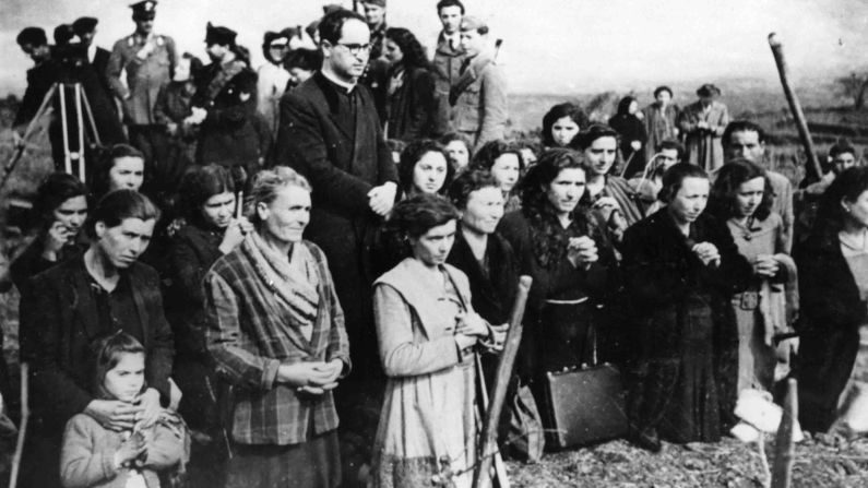 Villagers pray for help at the foot of Etna as lava advances toward their homes in 1947.