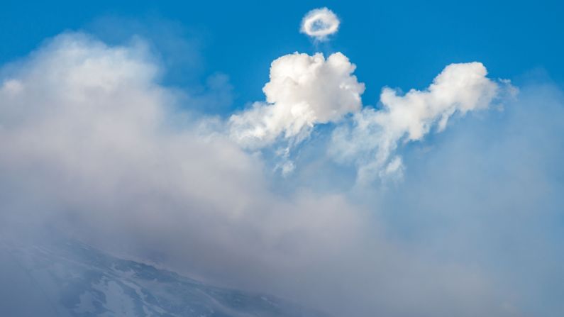 Mount Etna produces a steam ring, a rare occurrence for volcanoes, on November 11. At approximately 3,350 meters (10,991 feet), Etna is Europe's highest and most active volcano.