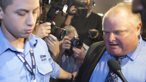  Toronto Mayor Rob Ford is surrounded by the media as he leaves his office at Toronto City Hall on November 15.
