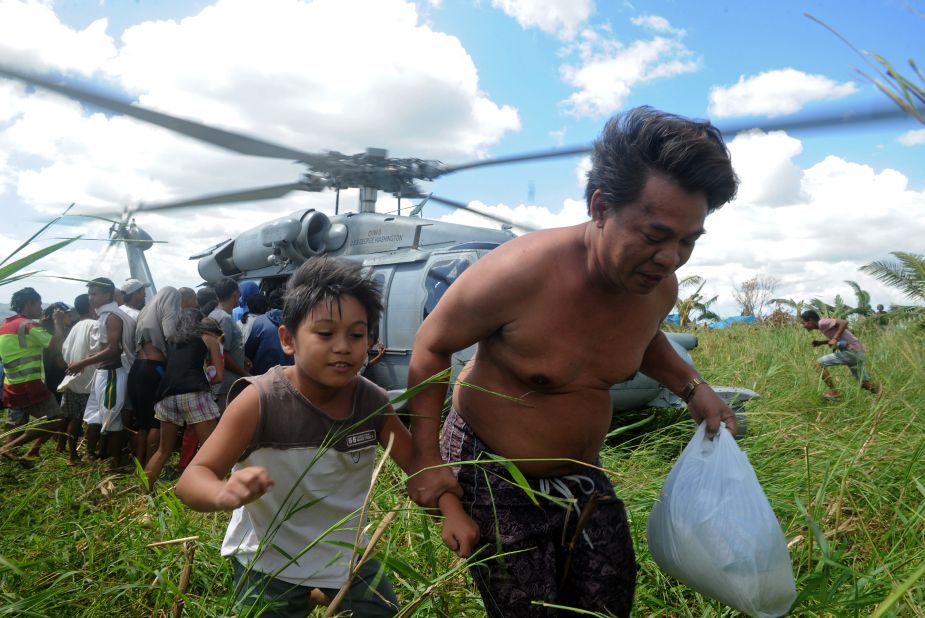 A U.S. Navy helicopter delivers relief goods to typhoon victims in Ormoc, Philippines, on November 18.