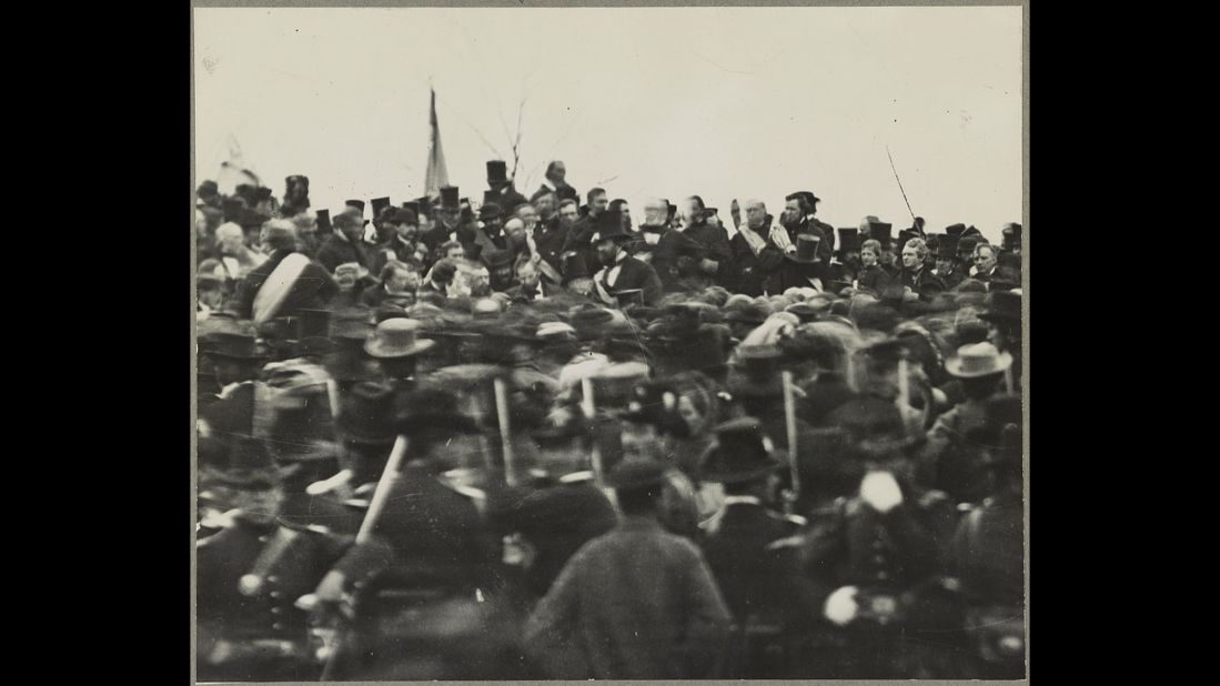 A crowd gathers to hear President Abraham Lincoln deliver the Gettysburg Address on November 19, 1863. Lincoln is seen in the center, just to the left of the bearded man with a top hat.