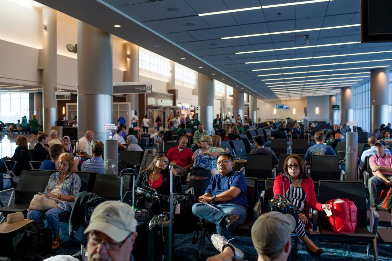 Passengers wait for flights in the International Terminal.