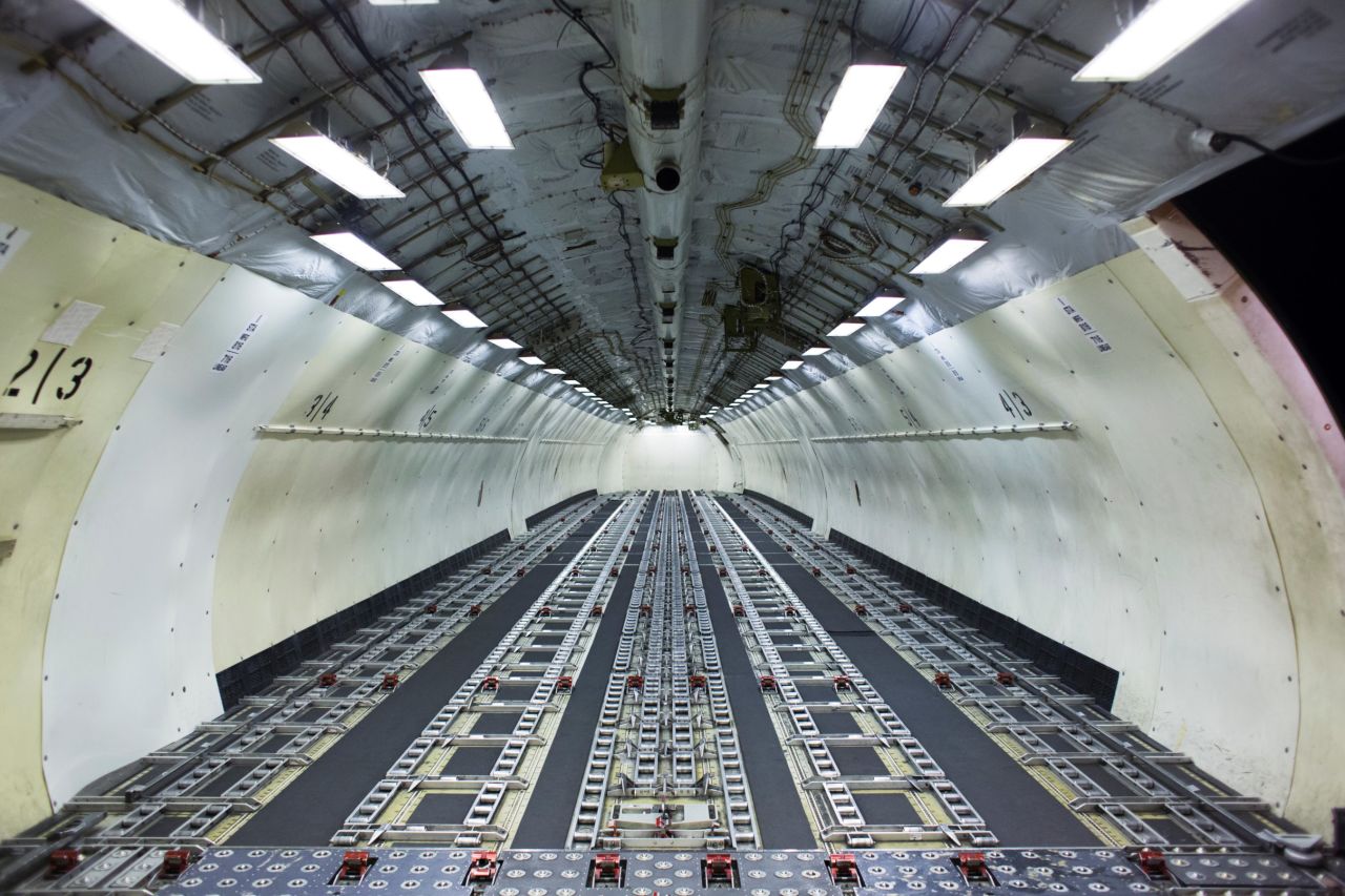 The interior of a cargo plane is barren as it awaits loading at the airport's UPS facility.