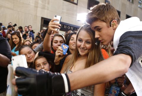 Singer Justin Bieber takes a selfie with a fan before appearing on NBC's "Today" show.