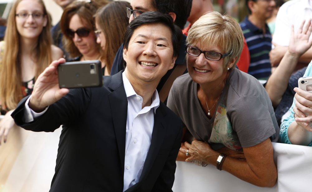 Actor Ken Jeong takes a photo with a fan before appearing on NBC's "Today" show.