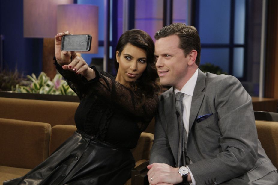 Television personalities Kim Kardashian and Willie Geist take a selfie during "The Tonight Show with Jay Leno."