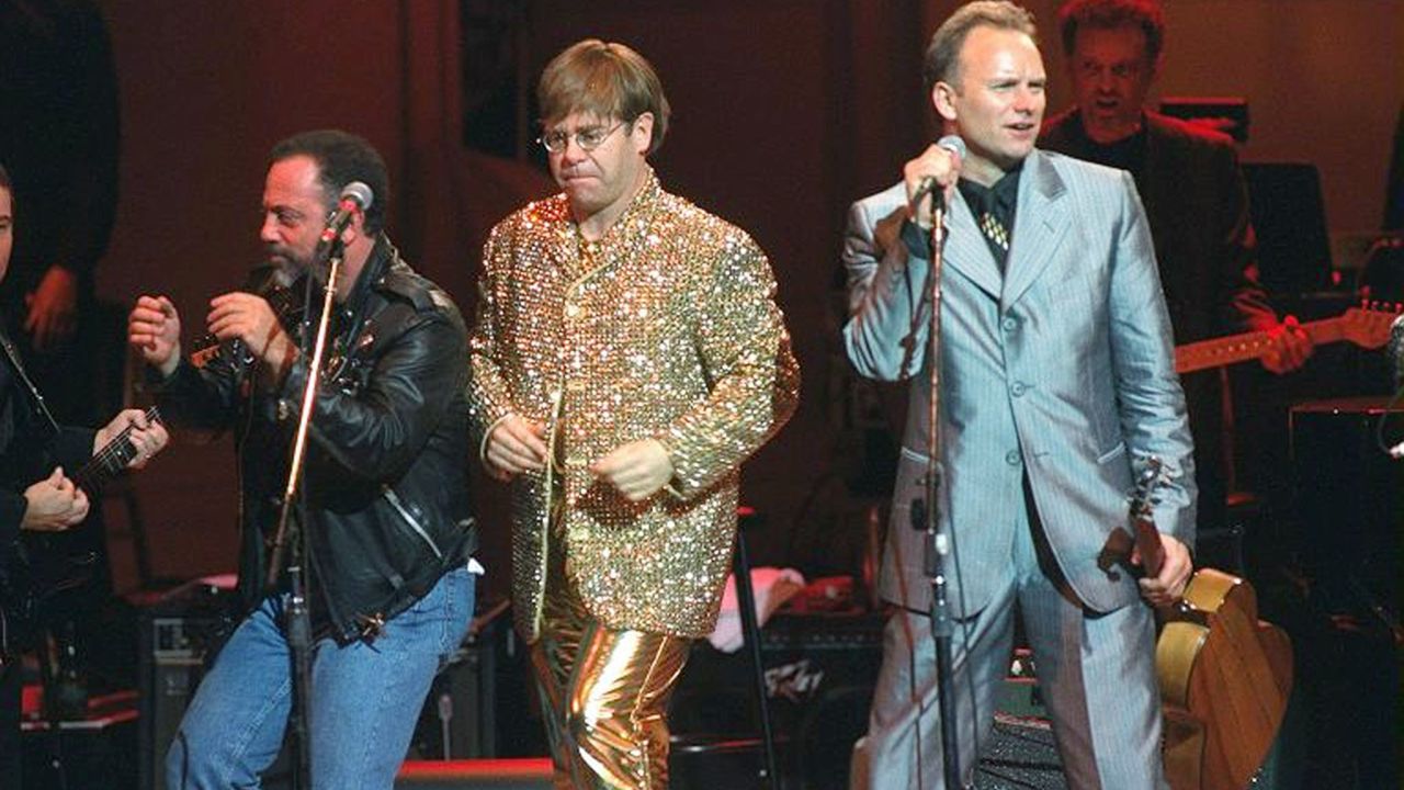 From left, Billy Joel, John and Sting perform at a benefit concert for the Rainforest Foundation in 1995. Joel and John toured together often during their careers.