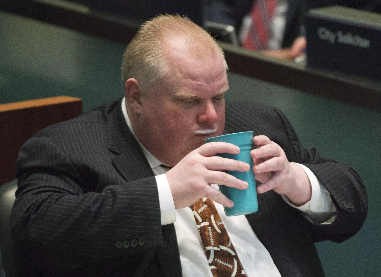 Ford displays a milk mustache as he takes part in voting with city council members November 14 in Toronto.