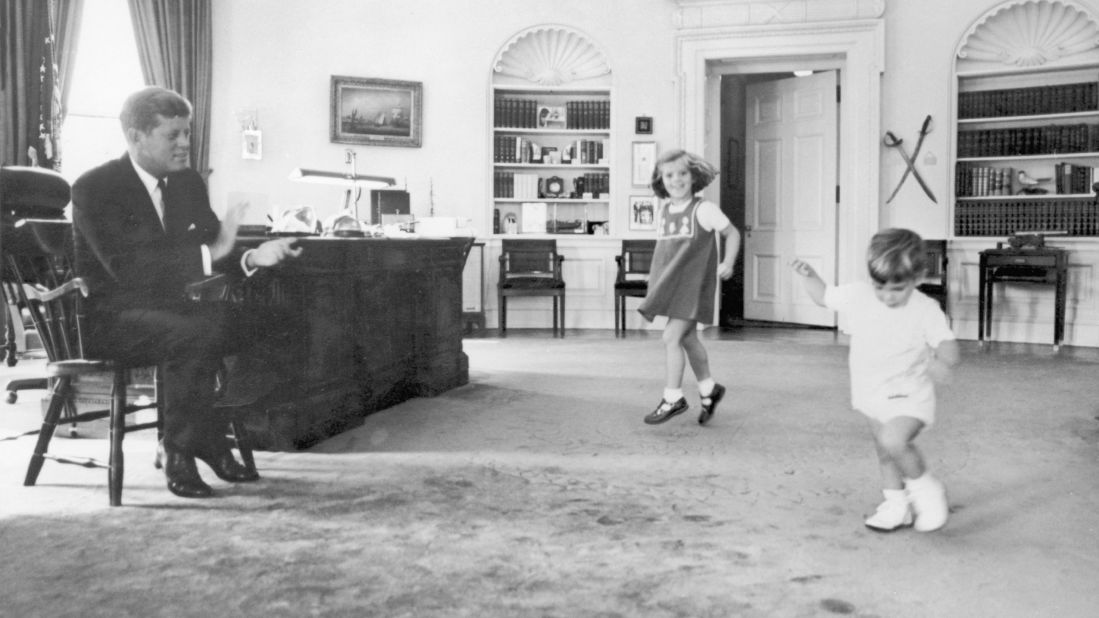 Caroline and her brother dance to their father's claps in the Oval Office in 1962.