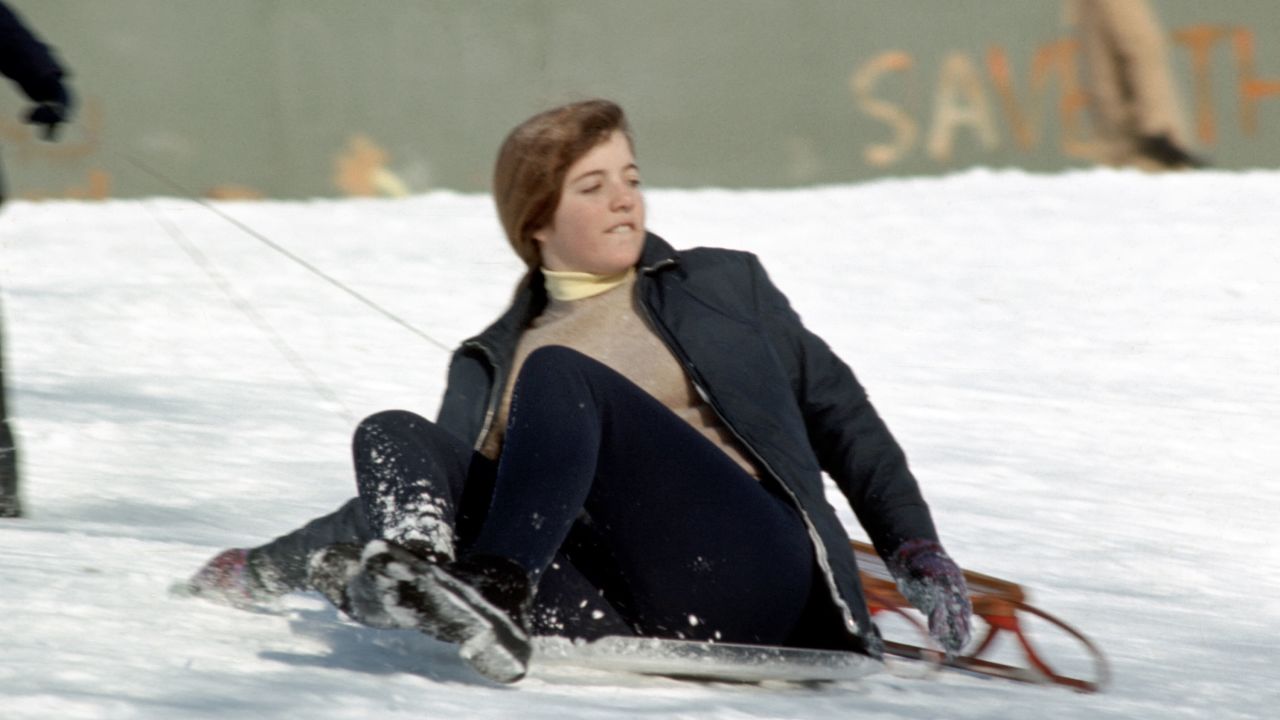 Caroline, 13, sleds down a hill in New York's Central Park in 1971.