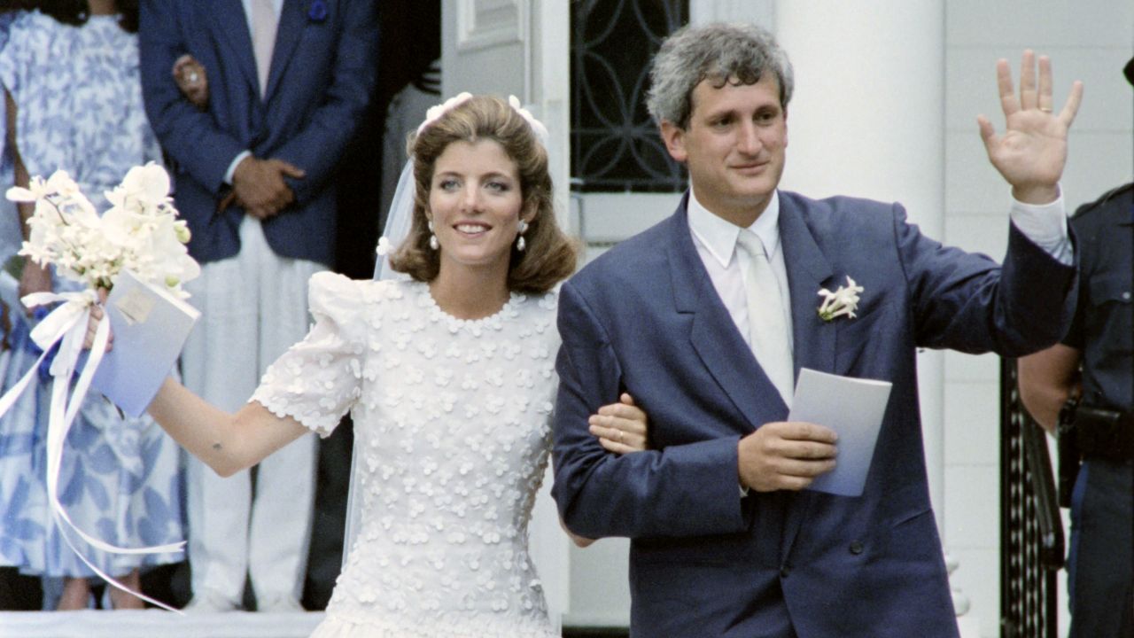 Kennedy and Edwin Schlossberg wave after their wedding ceremony in 1986.