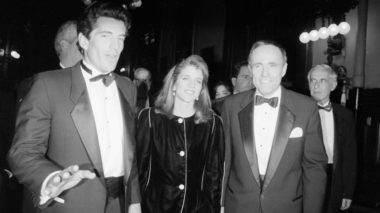 Kennedy spends time with her brother, left, and New York Mayor Rudy Giuliani in 1994.
