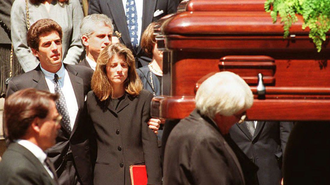 Kennedy and her brother watch as their mother's casket is carried away from a New York City church in 1994.