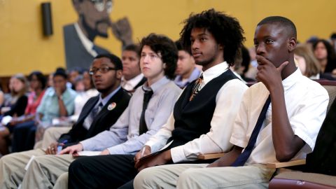 Students listen to Education Secretary Arne Duncan at an event in Washington in August.