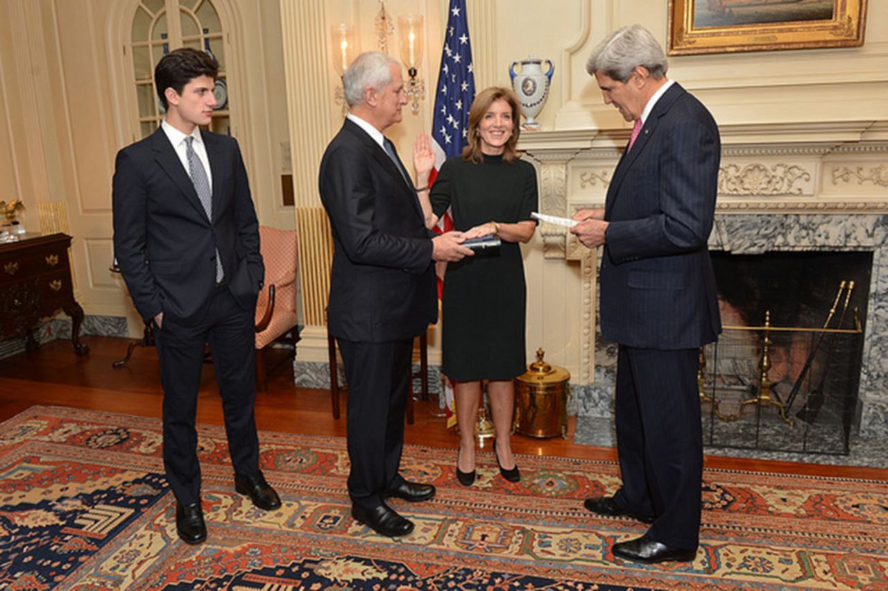 Kennedy is sworn in as U.S. ambassador to Japan by Secretary of State John Kerry, right, on November 12 in Washington. To her right is her husband and her son, John.