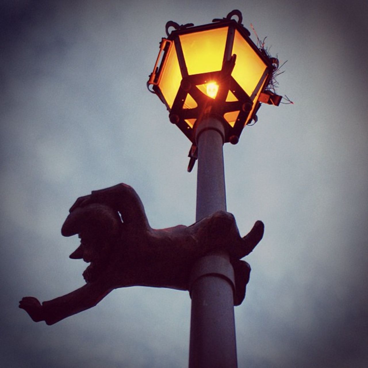 An ornamental gnome clings to a lamppost. Wroclaw is famed for the tiny statues that can be found dotted across the city, often in unusual locations.
