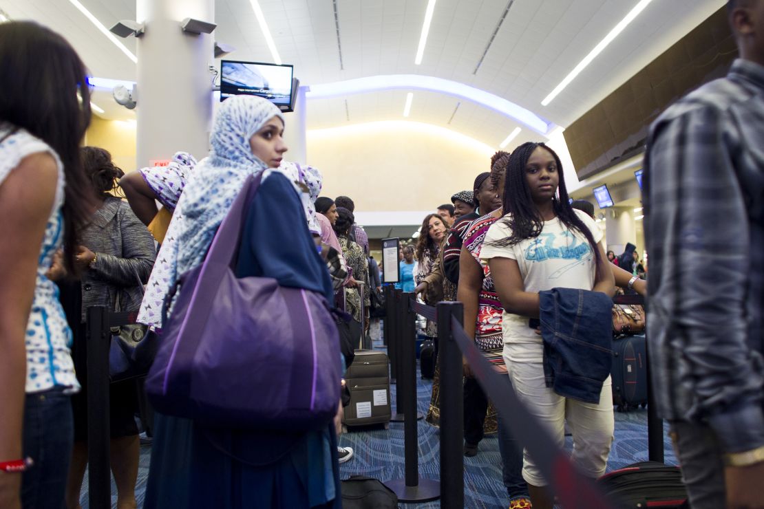 Passengers wait at a customs checkpoint at Atlanta's Hartsfield-Jackson International Airport.