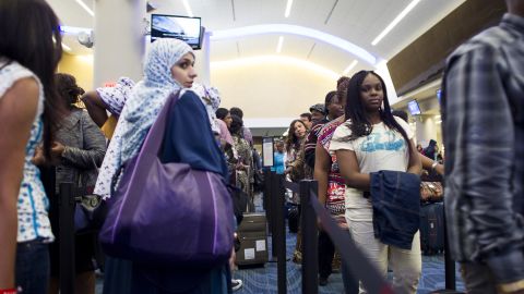 Passengers wait at a customs checkpoint at Atlanta's Hartsfield-Jackson International Airport.