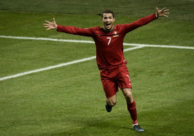 Cristiano Ronaldo celebrates the second of his three goals on a night when he not only sent Portugal to the World Cup but also became his country's joint top scorer (47 goals). 