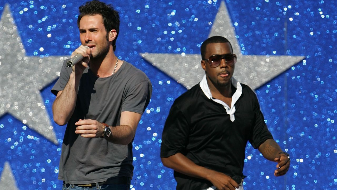 Levine sings with Kanye West in Los Angeles in 2005.