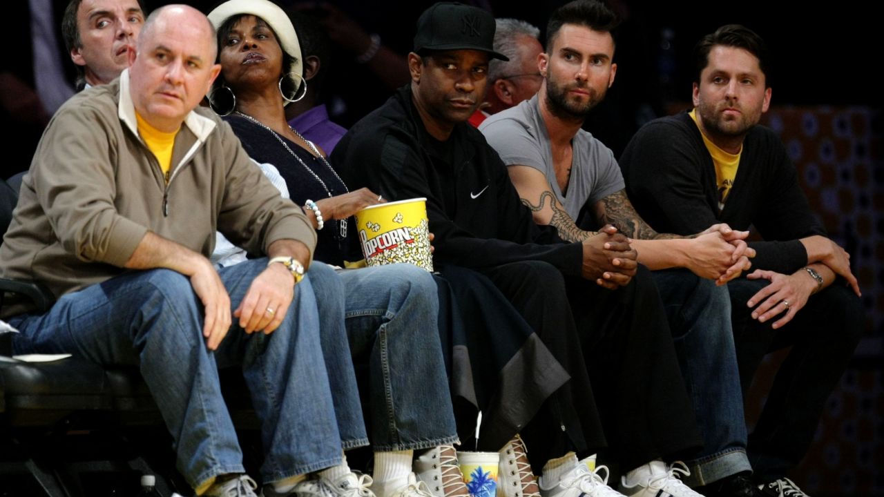 Levine, second from right, sits with Denzel Washington, center, at a 2009 NBA playoff game between the Los Angeles Lakers and the Denver Nuggets at the Staples Center in Los Angeles.