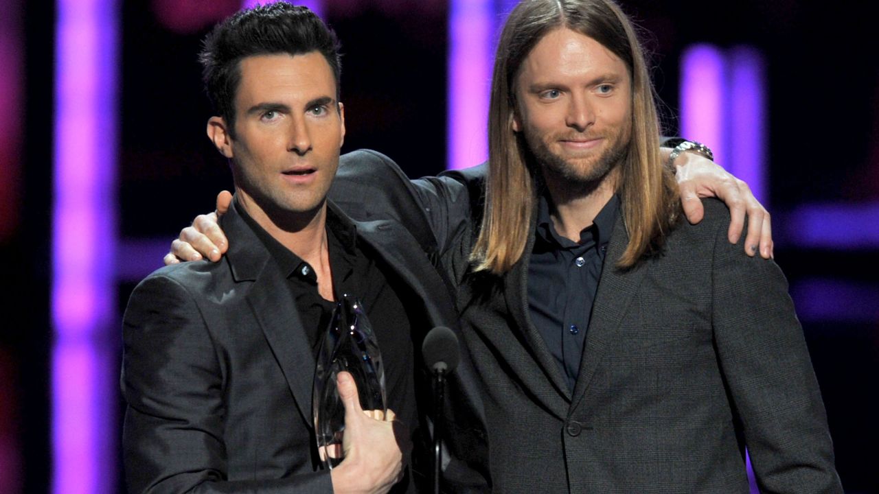 Levine and bandmate James Valentine accept their People's Choice Award for Favorite Band in 2012 in Los Angeles.