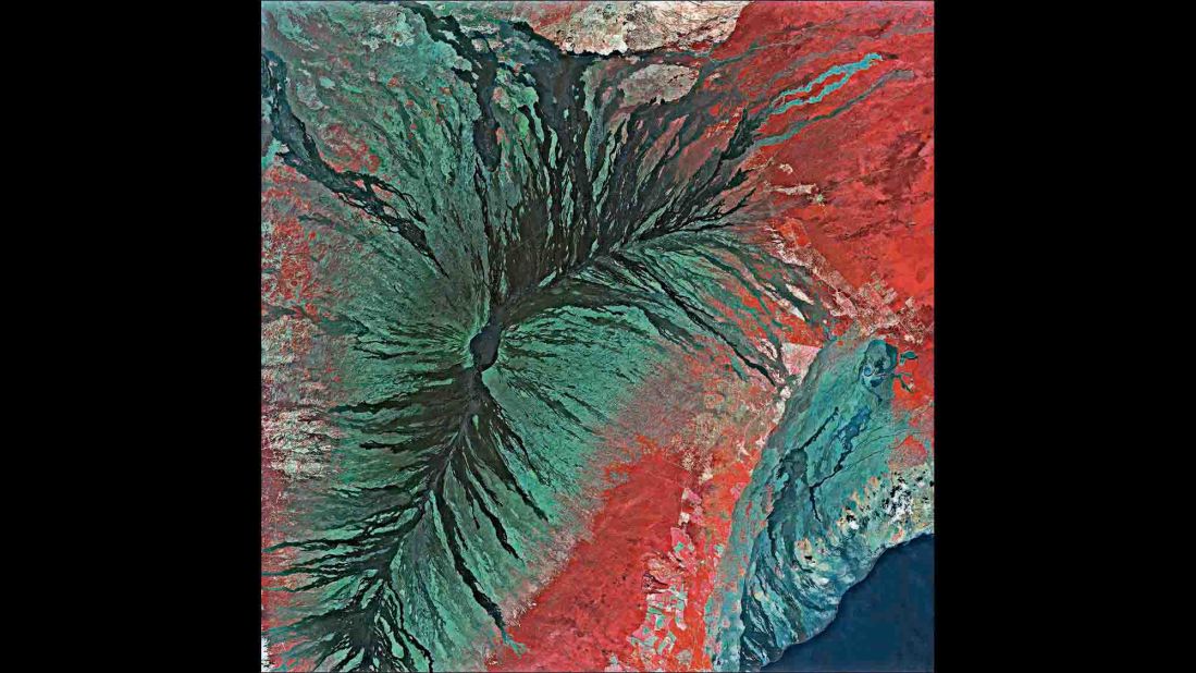 A new book of photographs, "Earth From Space," contains more than 150 high-resolution images shot from orbiting satellites. Seen from the perspective of hundreds of miles, many of Earth's features resemble abstract art. This image is of the Mauna Loa volcano on the big island of Hawaii.