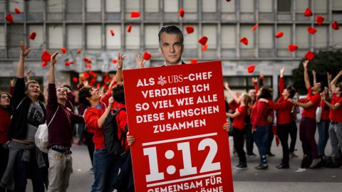 Supporters of the Swiss 1:12 initiative demonstrate in Zurich on November 2.